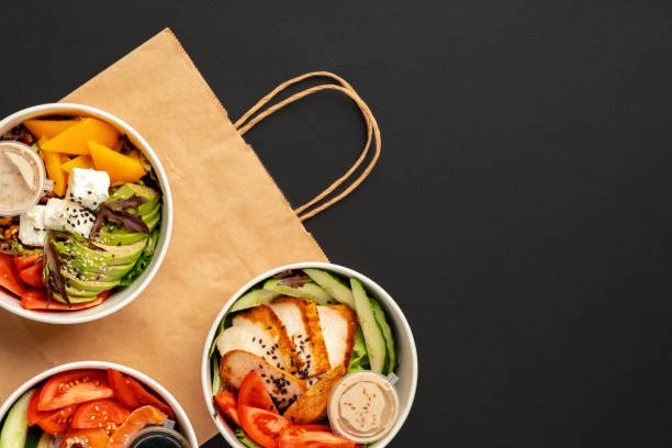 istock Side view of fresh poke bowls on black background 2157876835