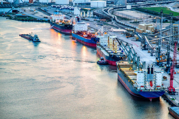 Oil rig support vessels berthed in Aberdeen harbour at dusk