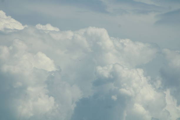 Bright White clouds against The bright Blue Sky In Summer