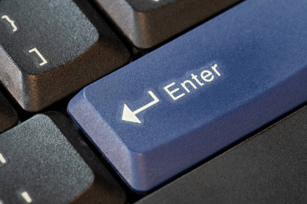istock Blue enter key on a modern laptop computer keyboard object symbol macro detail, extreme closeup, nobody. Highlighted enter key concept, no people. Confirming an action, accepting, entering data entry 2157883209