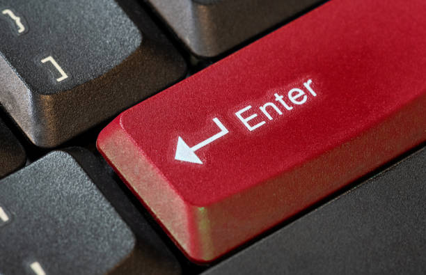 istock Large bright red colored enter key on a computer keyboard, confirmation call to action abstract concept, object closeup macro detail, nobody. Accepting, confirming an action, buying, sending messages 2157883381