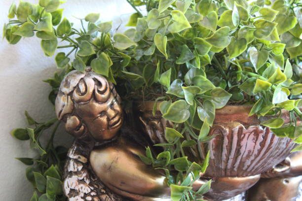 Golden Angel Statue Planter With Lush Green Plants