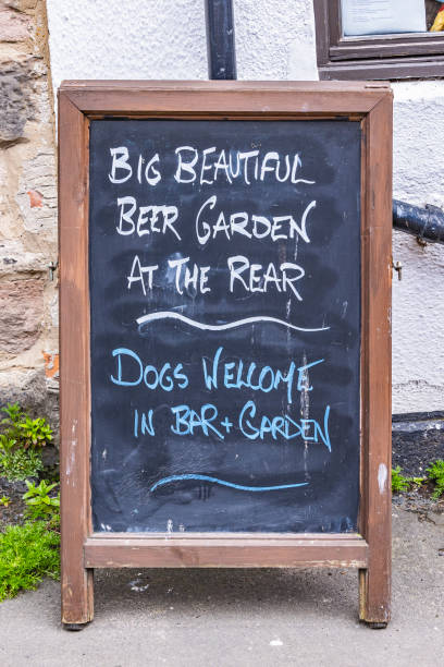 Lindisfarne, Holy Island, Berwick-upon-Tweed, Northumberland, England, Great Briton, United Kingdom. Chalkboard sign outside a pub on Holy Island.