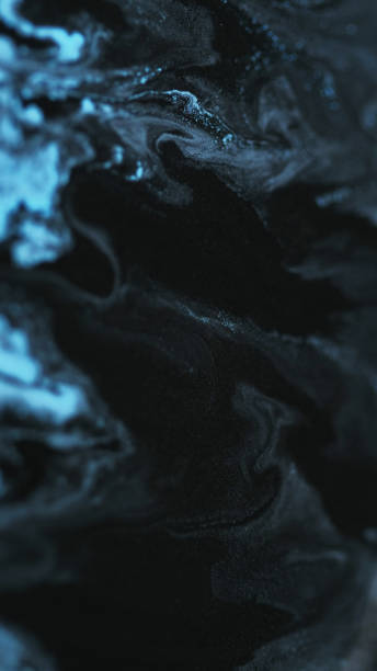 istock Shiny paint drip glitter fluid wave black blue ink 2157897661