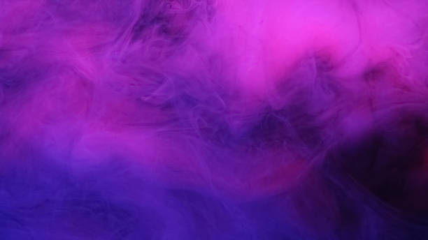 istock Neon mist paint water purple blue glitter smoke 2157898326