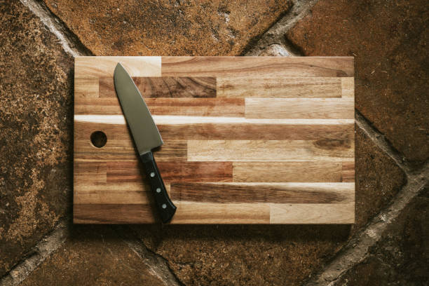 istock Chef's knife on a wooden cutting board flatlay 2157898803