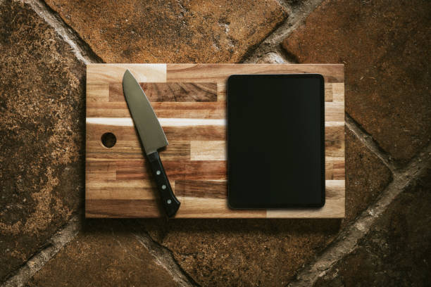 istock Tablet mockup on wooden cutting board flatlay 2157898809
