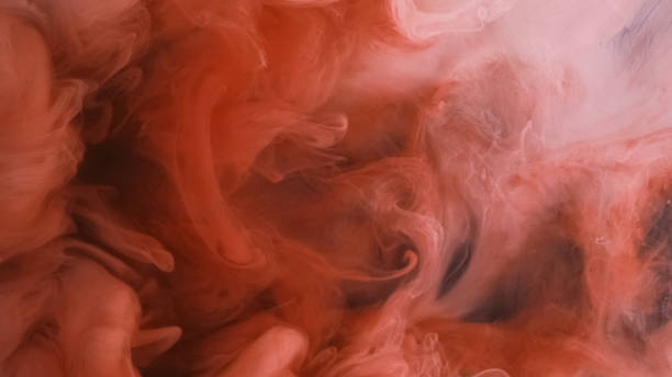 istock Explosion cloud ink water drop orange dust smoke 2157899520