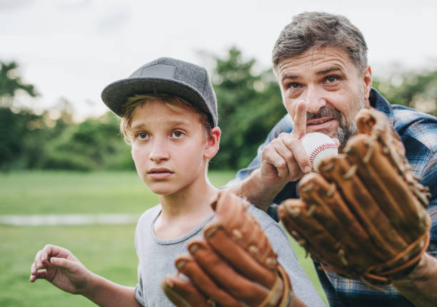 istock Father and son bonding over baseball 2157899587