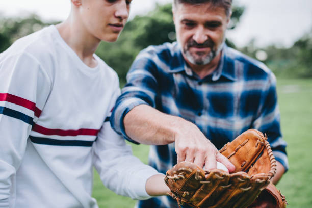istock Father and son bonding over baseball 2157899602