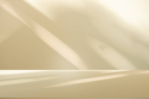 istock Wall interior background, studio and backdrops show products.with shadow from window color white and beige . background for text insertion and presentation product 2157901414
