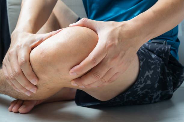 istock Knee pain man He puts his hands on his knees, pain points from osteoarthritis and bone diseases, medical concepts and treatments. 2157901461