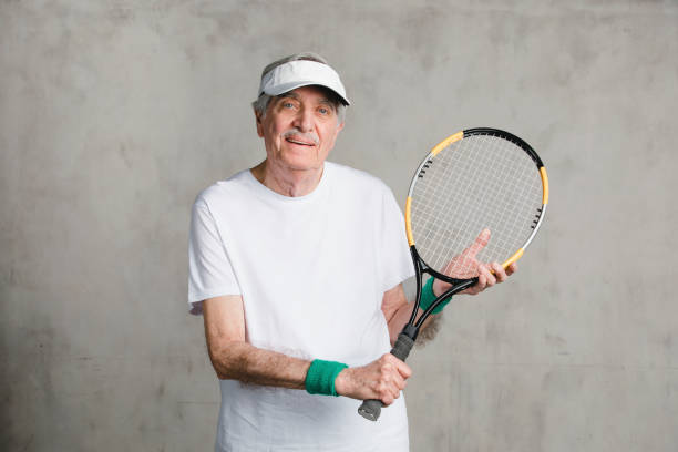 istock Cheerful senior man with a tennis racket 2157901836