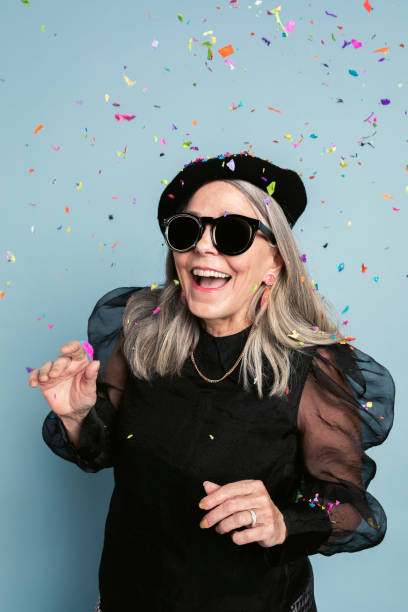 istock Cool grandma celebrating with confetti 2157902855