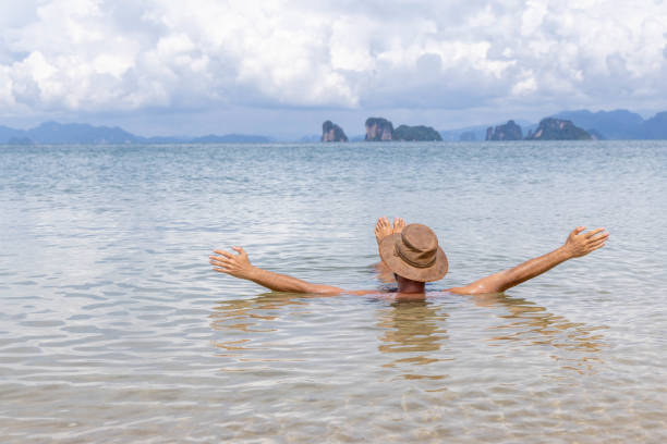 istock Man Floating with Arms Outstretched in Sea 2157906601