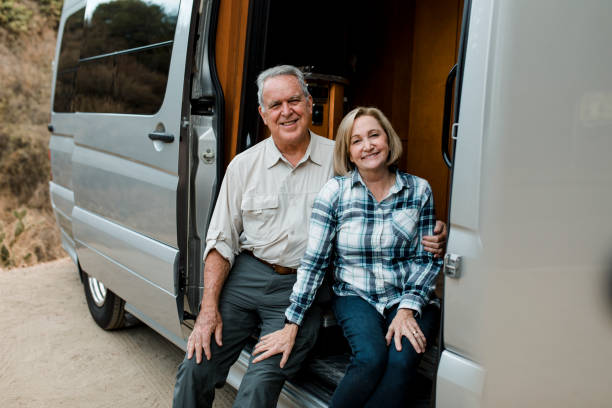 istock Happy senior couple travel with camper van 2157909027