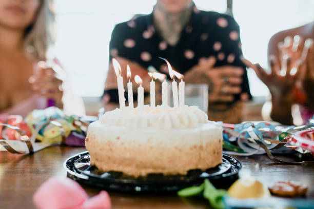 istock Bringing up the birthday cake 2157909876