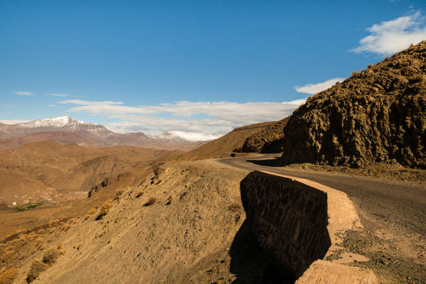 Atlas of Morocco in the background of the image. View from the road. Beautiful morning light on the mountain pass.