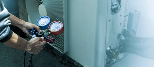 istock Air conditioning, HVAC service technician using gauges to check refrigerant and add refrigerant. 2157911715