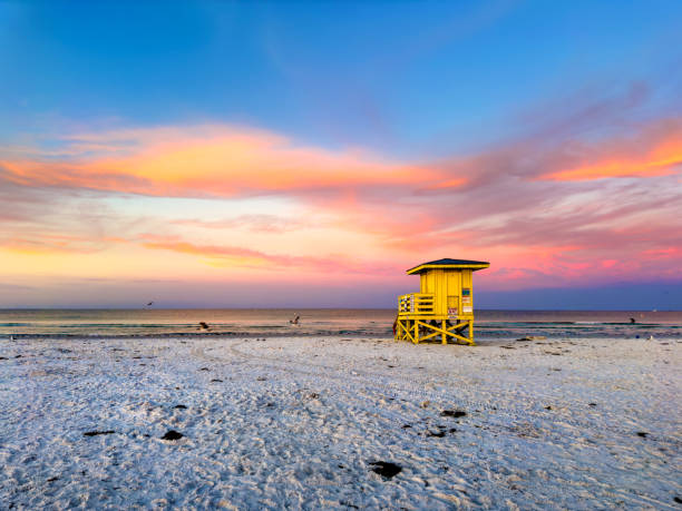 istock Lifeguard hut on tropical sandy beach  during sunset 2157911861