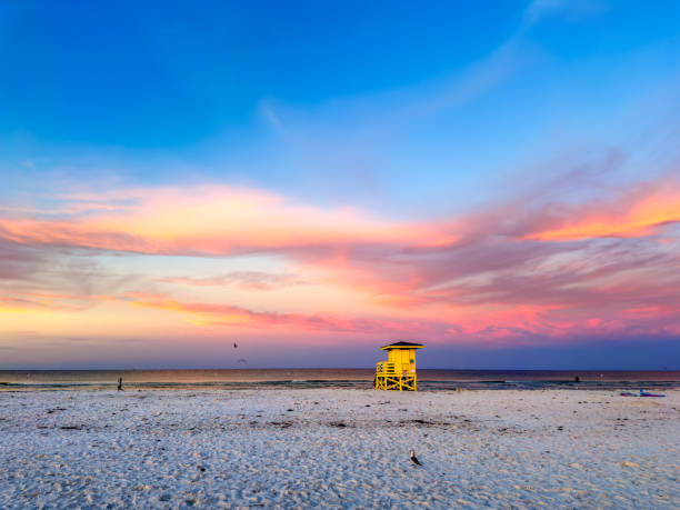 istock Tropical sandy beach with lifeguard hut during sunset 2157911862