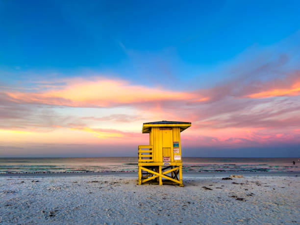 istock Lifeguard hut on tropical sandy beach  during sunset 2157911879