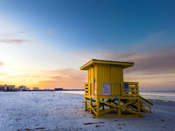close up of Deauville, France,  Lifeguard look out post on the beach.  A wooden building with outside steps for the lifeguards , on sand looking out to sea with deep blue sky background
