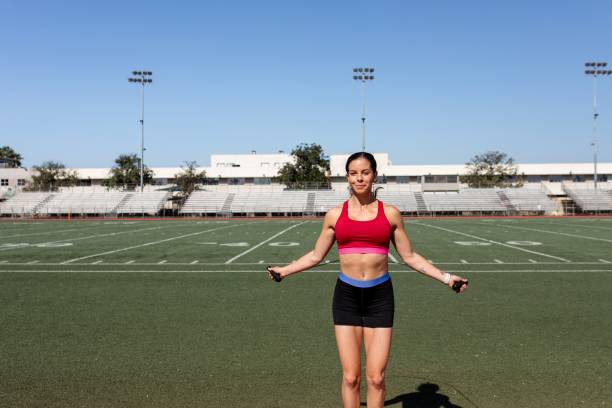 istock Woman athlete skipping rope in a stadium 2157912215