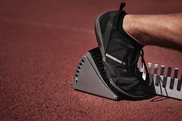 istock Athlete's foot on sprint starting block 2157912313