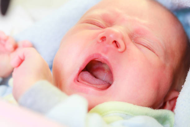 istock Little newborn sad baby crying 2157913646
