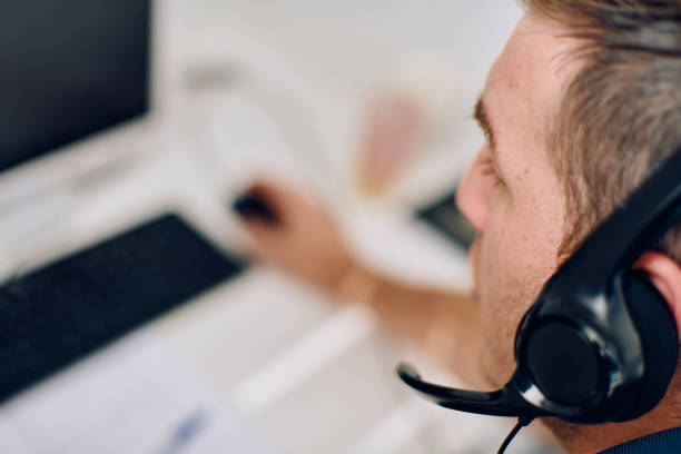 istock Close Up Portrait of a Customer Support Representative in a Call Center Environment. 2157913813