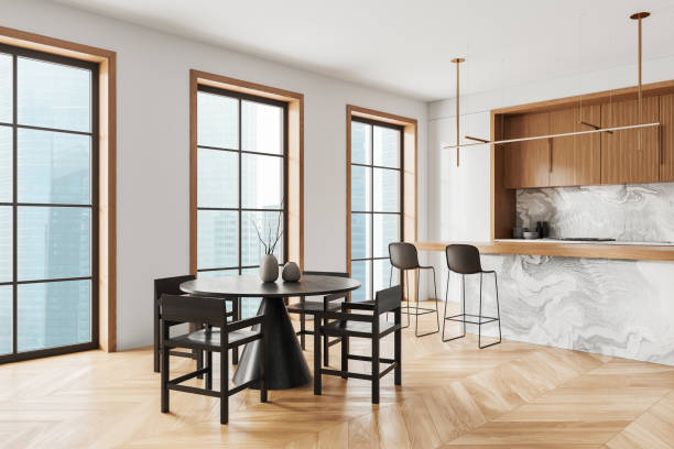 istock Modern home kitchen interior with bar counter and eating table, window 2157914910