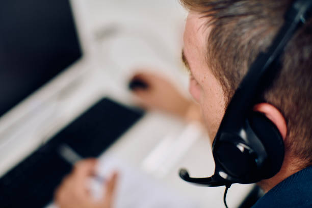 istock Close Up Portrait of a Customer Support Representative in a Call Center Environment. 2157915094