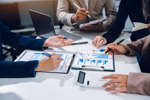 istock Businessmen team or financial data analysts working with tablets and laptop computers and data graphs together. Plan to analyzing projects in the office. 2157916074
