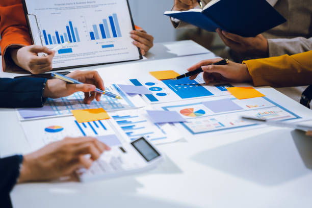 istock Businessmen team or financial data analysts working with tablets and laptop computers and data graphs together. Plan to analyzing projects in the office. 2157916078