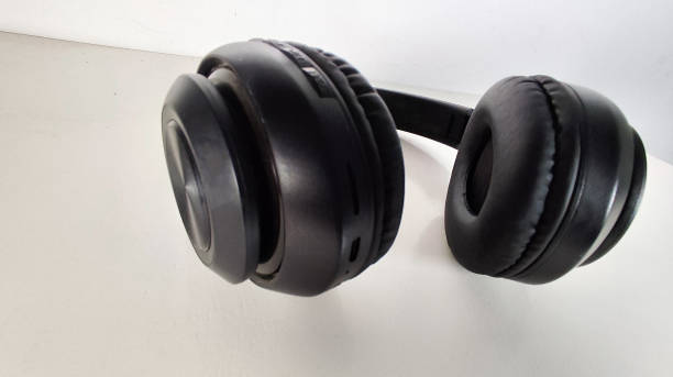 istock wireless headphones on the white background 2157916216