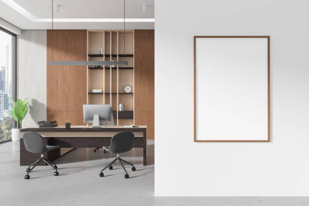 istock White ceo interior desk with armchair and sideboard near window. Mockup frame 2157916240