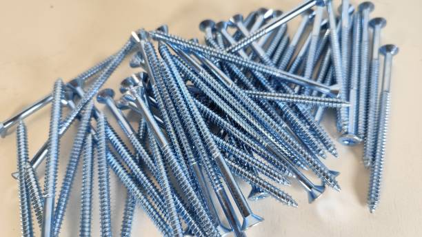 istock COLLECTION OF MESSY SCREWS ON  THE WHITE BACKGROUND 2157916385