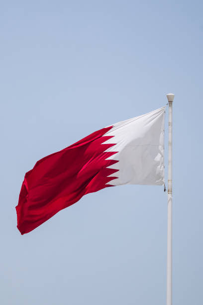 istock Waving flag of Qatar, in Doha 2157916483