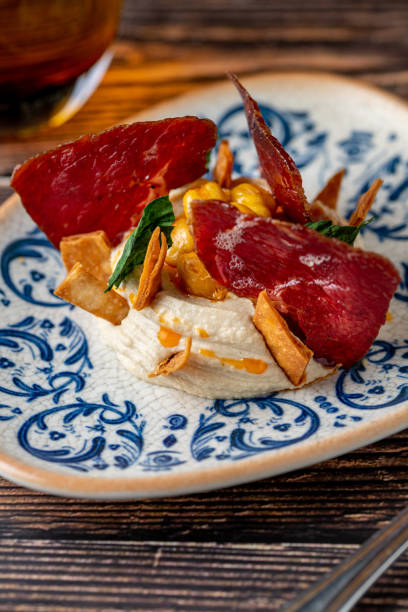 istock Hummus with pastrami, traditional Turkish dish, on wooden table 2157917191
