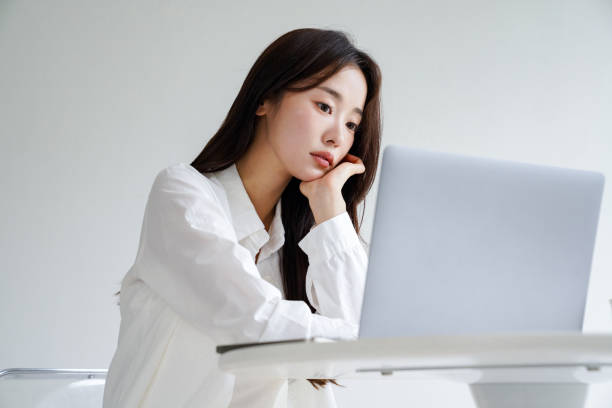 istock Beautiful Asian woman working at a desk 2157919962