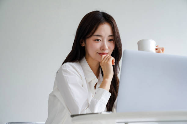 istock Beautiful Asian woman working at a desk 2157920191