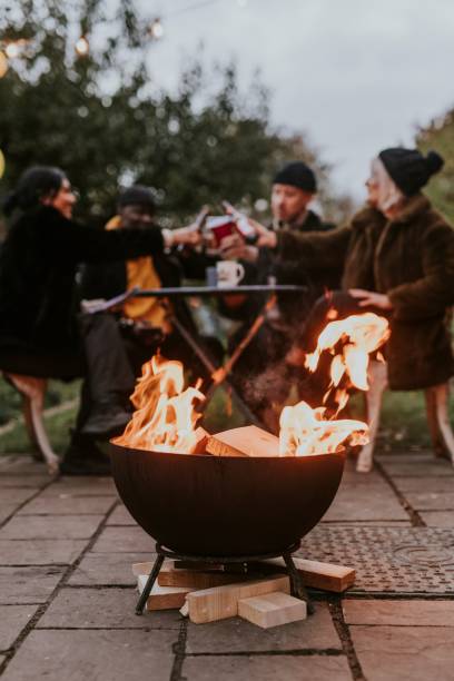 istock Friends celebrating by a fireside 2157922470