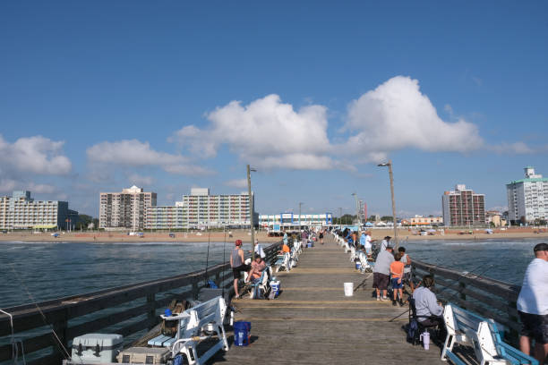 Virginia Beach, Va. USA:  June 15th 2024:  Along the Virginia Beach coastline is a fishing pier so the tourist and locals can use to catch fish out of the Atlantic ocean.