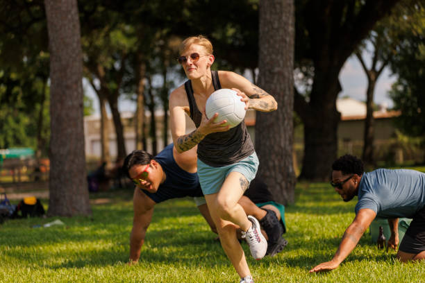 istock Dynamic dodgeball game in summer park 2157923116
