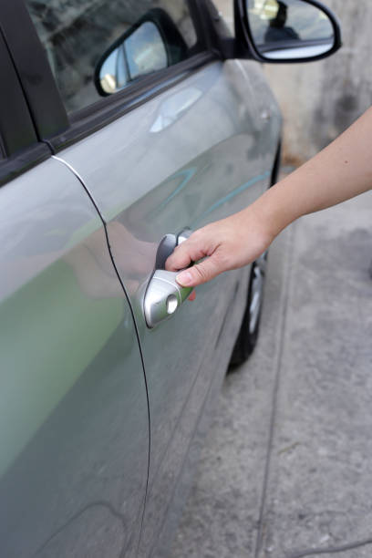 istock Male hand opening car door 2157923432
