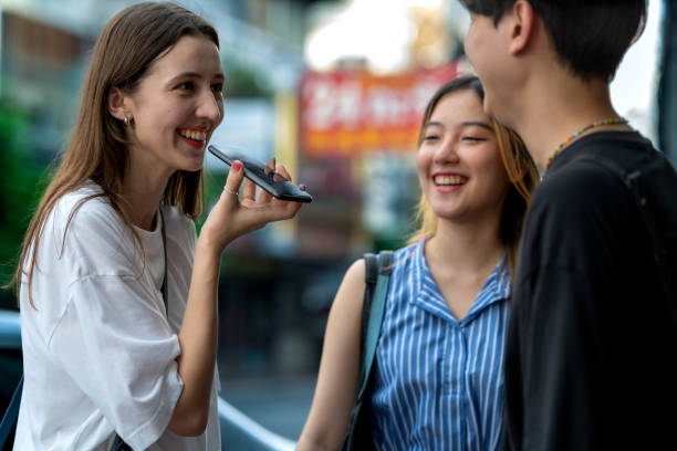 Foreign Tourist Using AI Translation Apps to communicate with Locals