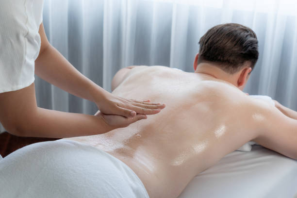 istock Masseuse prepare oil massage procedure for customer at spa. Quiescent 2157924575