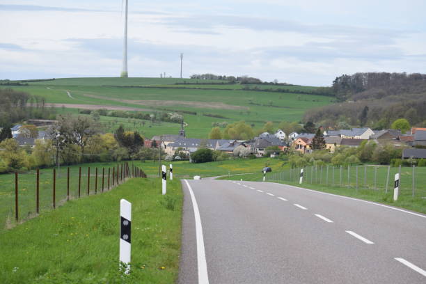 istock country road down into a village 2157926560