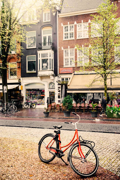 Amsterdam street, The Netherlands Café on Spuistraat in the city of Amsterdam, The Netherlands, on a wet Spring day in April. rainy cafe stock pictures, royalty-free photos & images